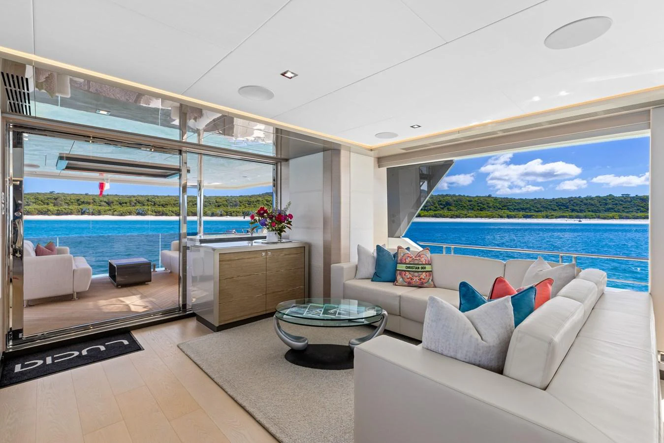 The salon offers a spacious and luxurious seating area with stunning ocean views. aboard G Yacht for Sale