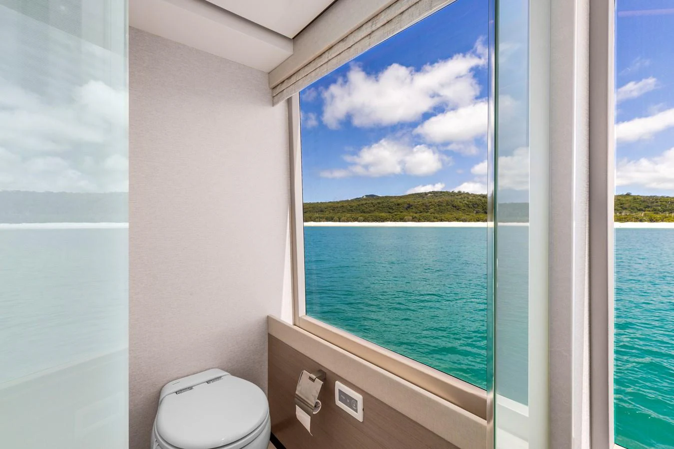 A modern yacht bathroom with a stunning ocean view through large windows. aboard G Yacht for Sale