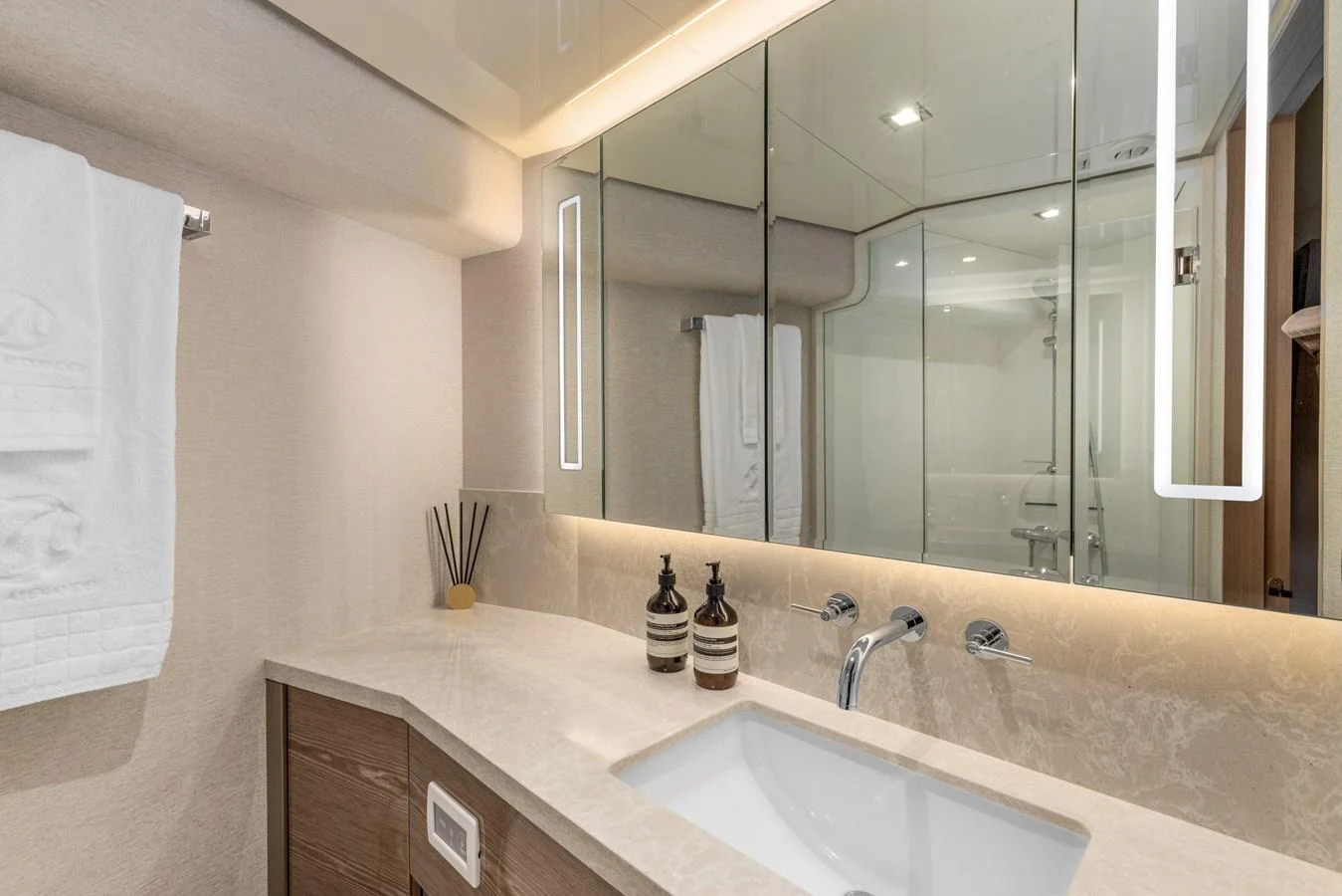 The yacht's bathroom features a sleek design with modern fixtures and ample lighting. aboard G Yacht for Sale