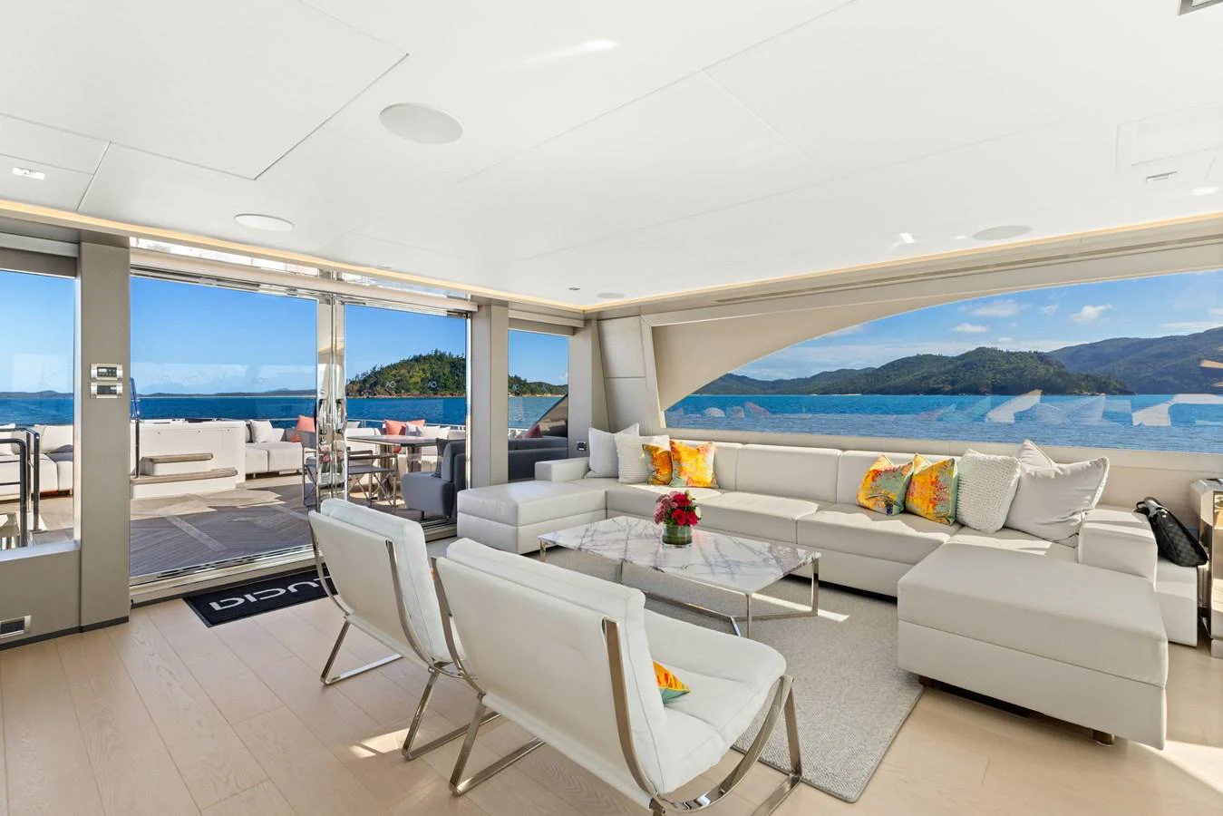 The spacious salon offers panoramic views and elegant seating arrangements. aboard G Yacht for Sale