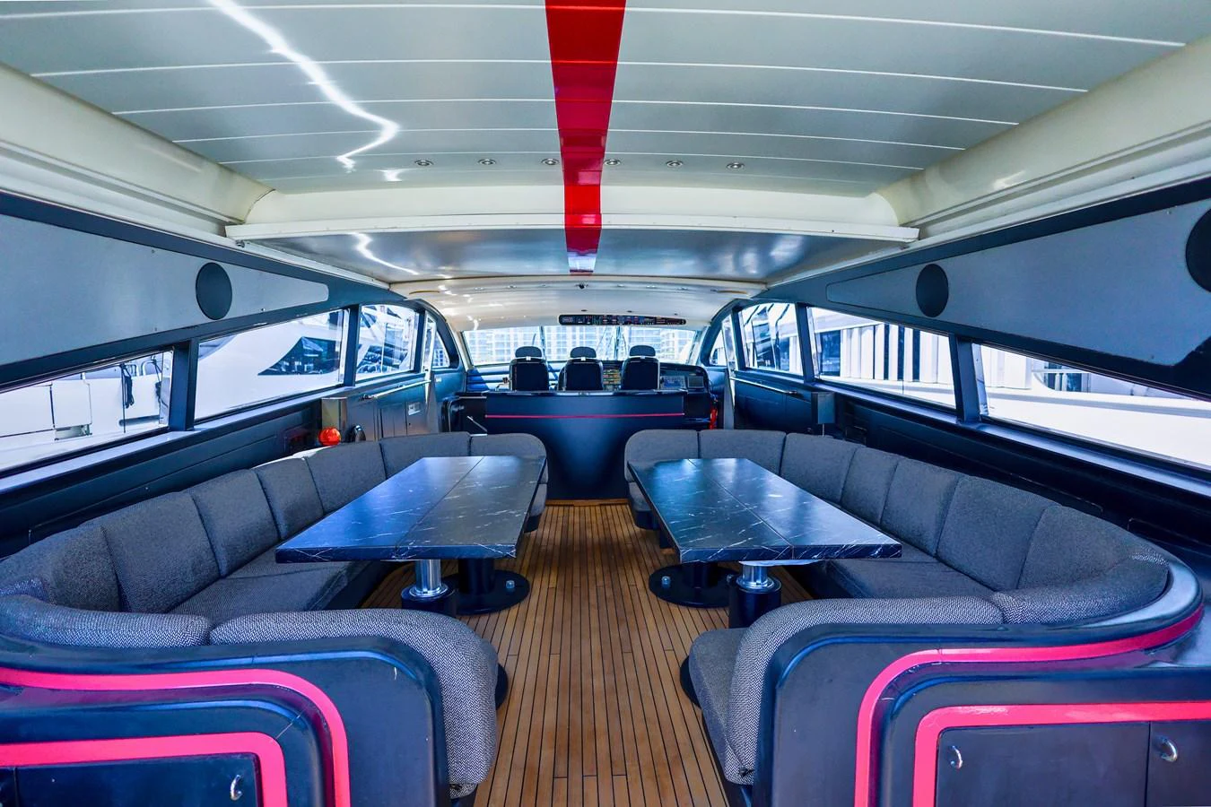 The yacht's saloon features a spacious seating area with modern furnishings and ample natural light. aboard SEA SQUIRTER Yacht for Sale