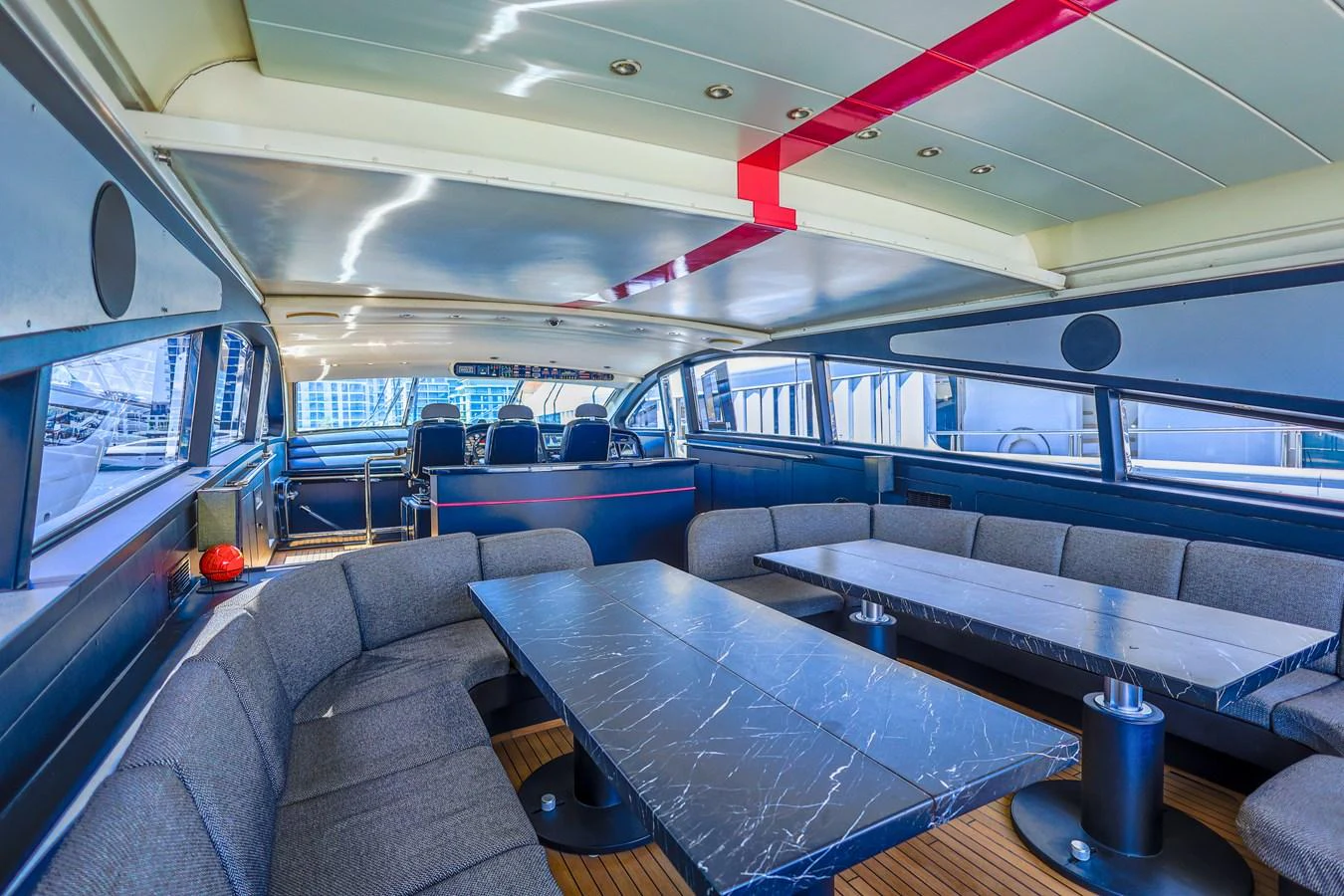 The spacious saloon features modern furnishings and ample seating for guests. aboard SEA SQUIRTER Yacht for Sale