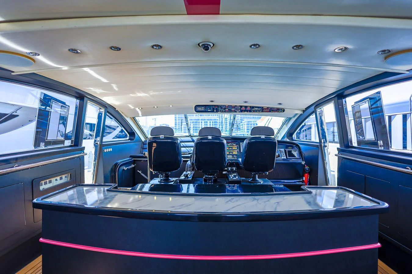 The helm station features modern controls and panoramic windows for an exceptional navigation experience. aboard SEA SQUIRTER Yacht for Sale