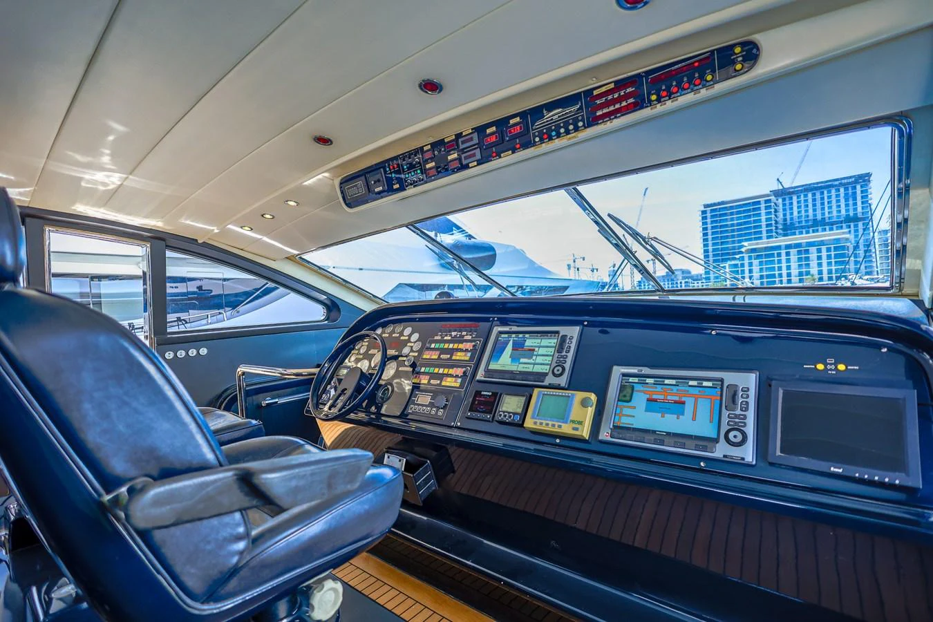 The helm station features advanced navigation equipment and a sleek, modern design. aboard SEA SQUIRTER Yacht for Sale