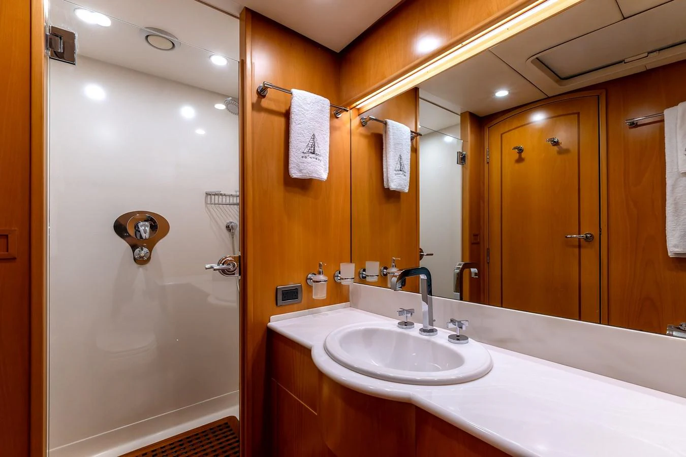The yacht's bathroom features a sleek design with a spacious shower and elegant fixtures. aboard EPIPHANY Yacht for Sale