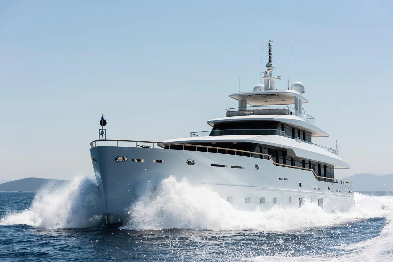 A sleek and modern yacht cuts through the water, showcasing its elegant design and powerful performance. aboard K Yacht for Sale