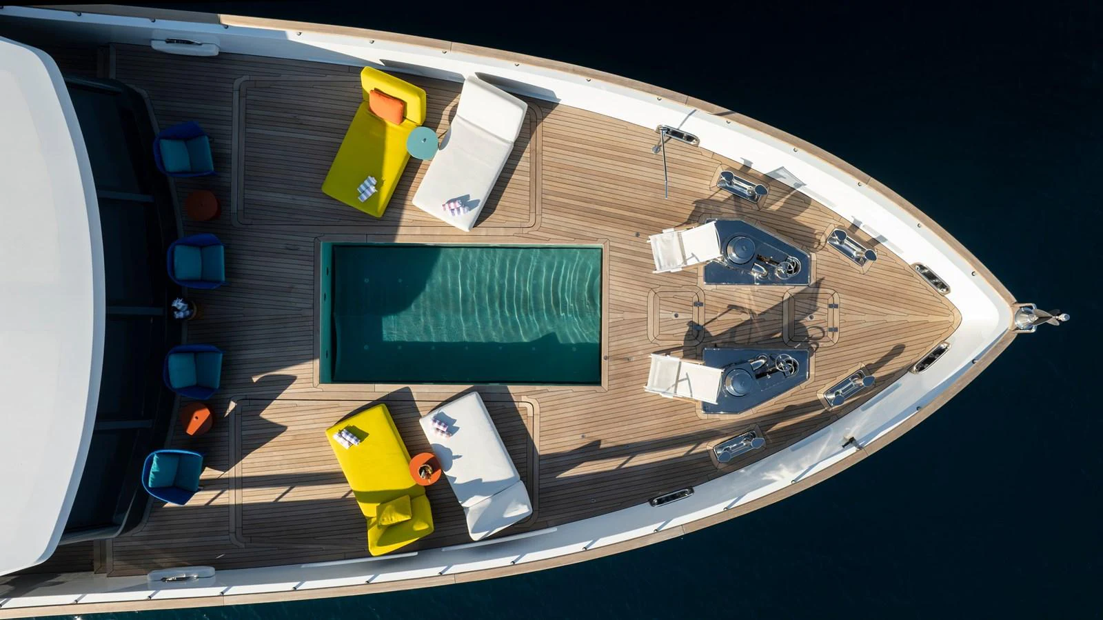 The foredeck features a luxurious pool surrounded by stylish sun loungers and seating areas. aboard K Yacht for Sale