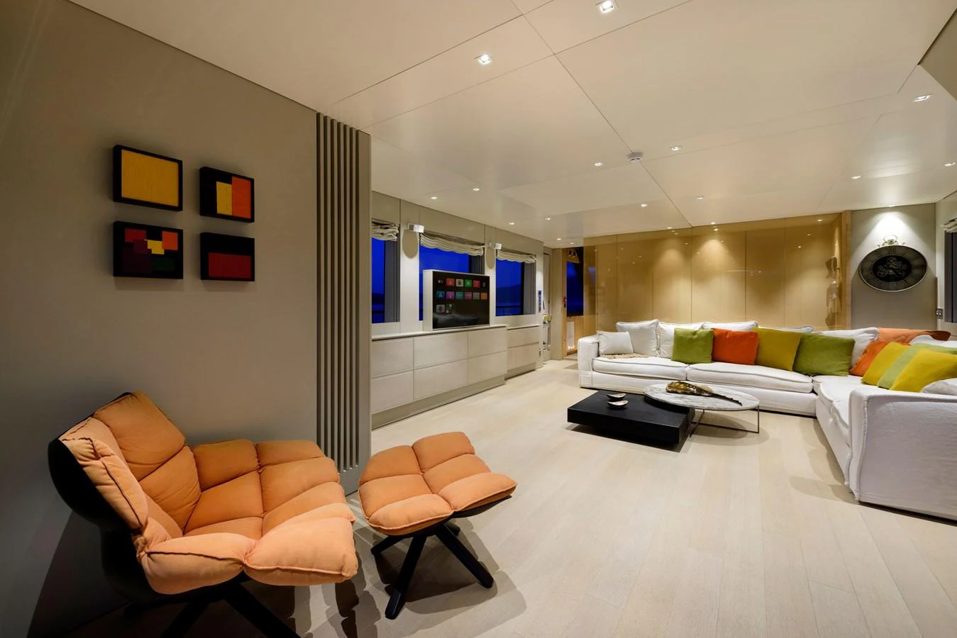 The salon features modern furnishings with a cozy seating area and contemporary decor. aboard K Yacht for Sale