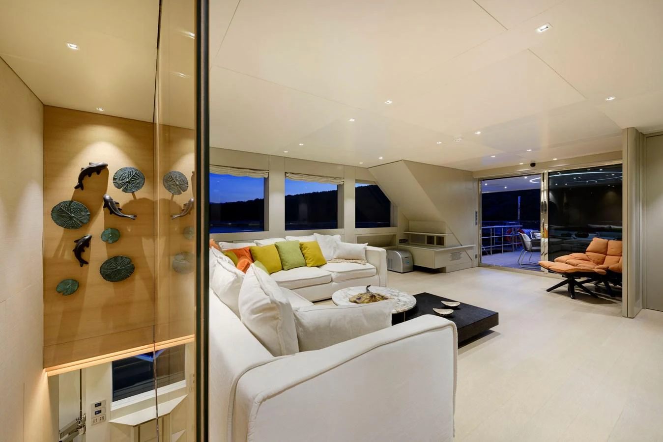 The salon features a spacious and elegant seating area with modern decor and ample natural light. aboard K Yacht for Sale
