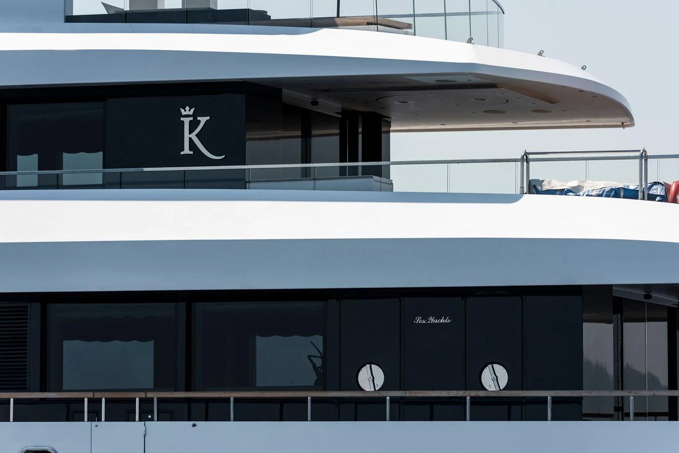 A sleek and modern yacht exterior showcasing its elegant design and branding. aboard K Yacht for Sale