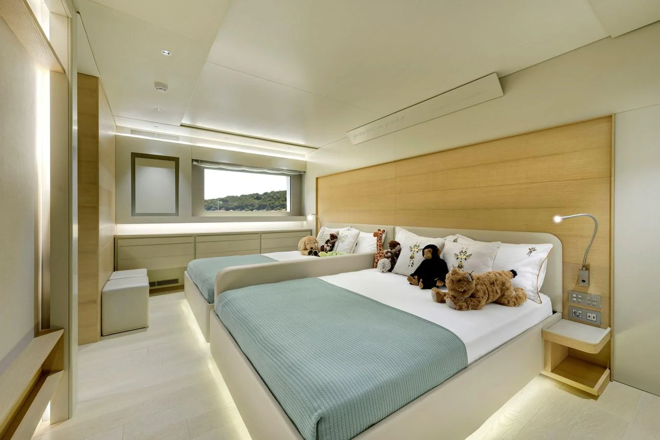 The guest stateroom features twin beds with plush bedding and a serene ambiance. aboard K Yacht for Sale