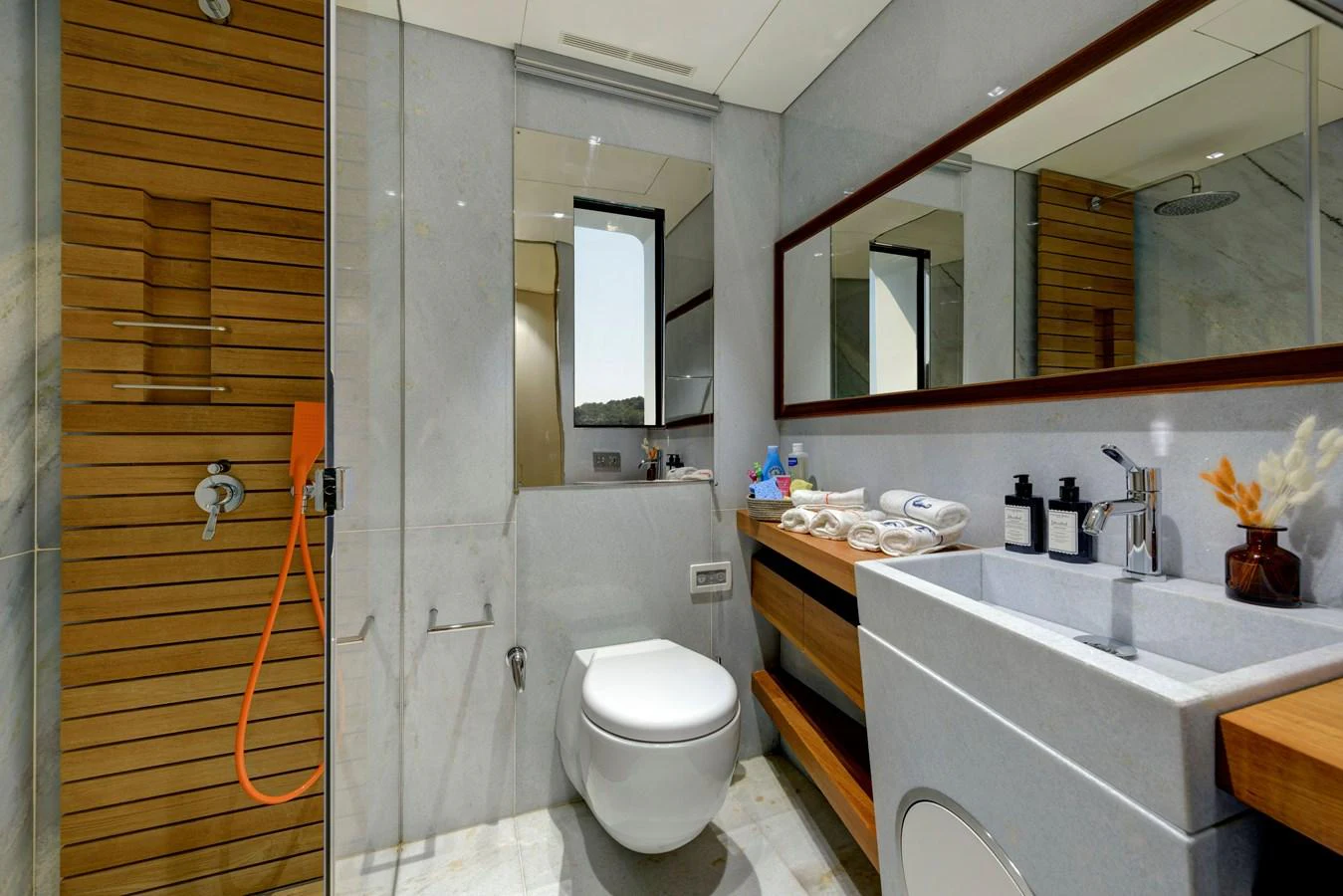 The yacht's bathroom features modern fixtures and a sleek design. aboard K Yacht for Sale