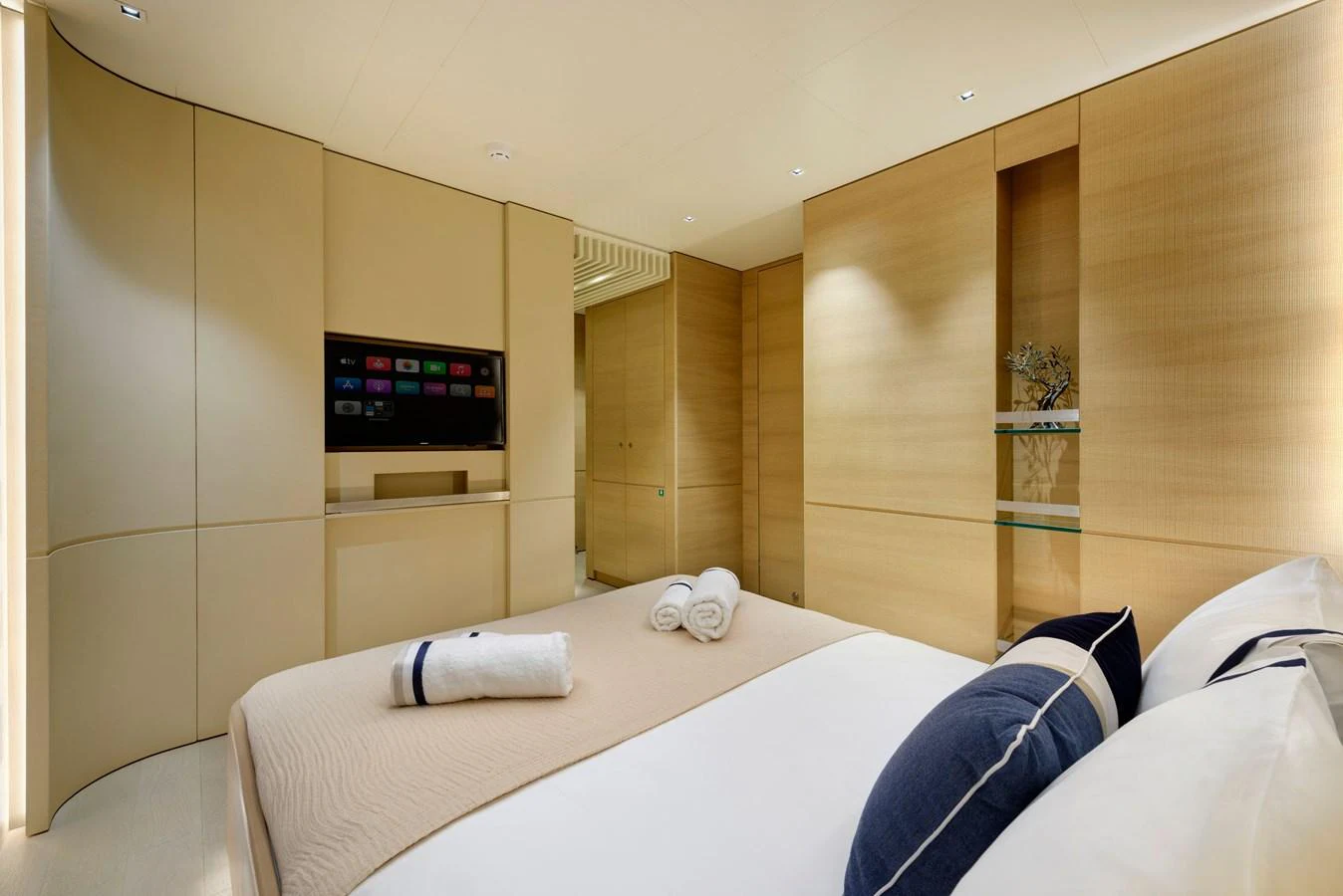 The stateroom features a modern design with a comfortable bed and a built-in entertainment system. aboard K Yacht for Sale