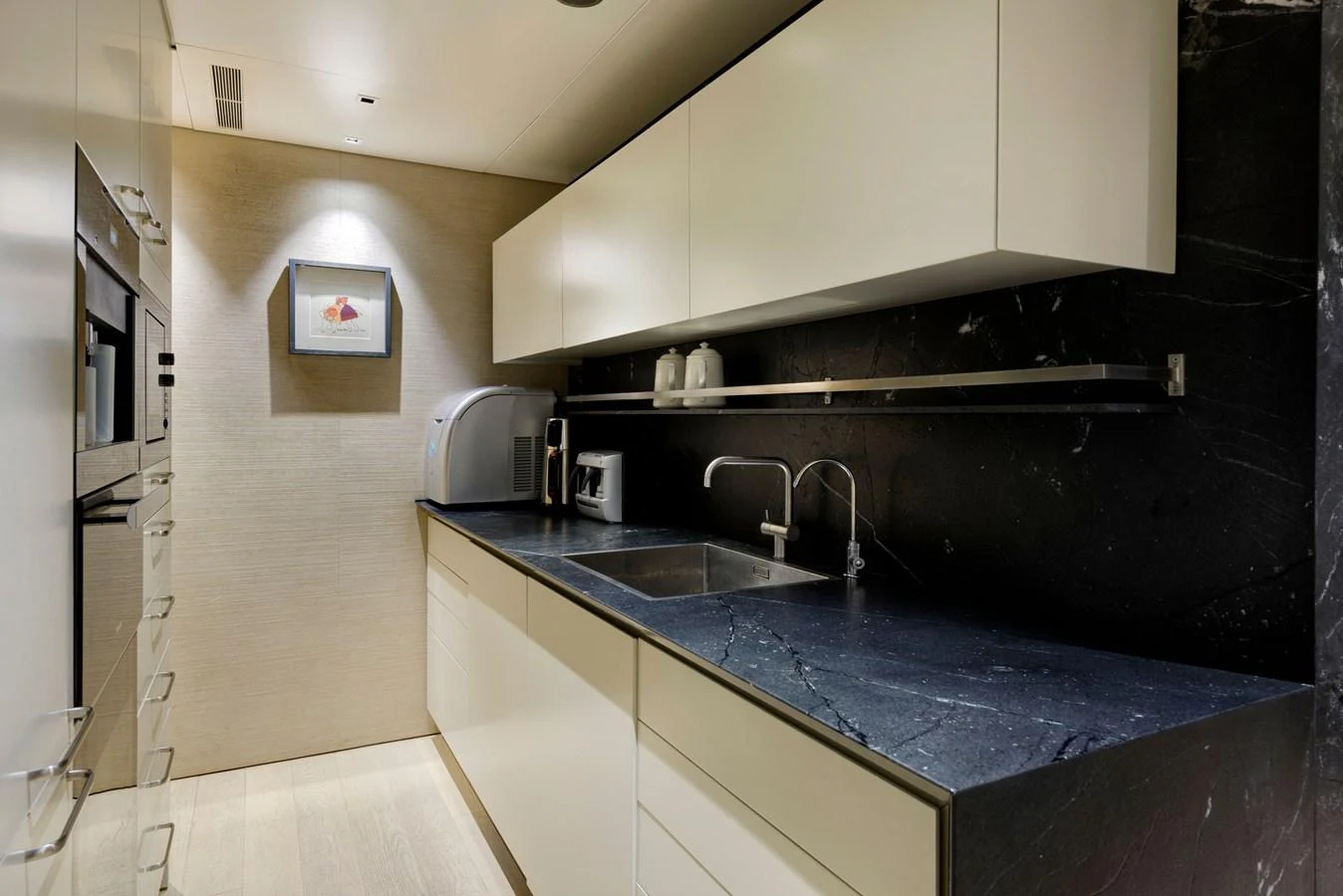 The galley features modern appliances and sleek cabinetry, perfect for gourmet meal preparation. aboard K Yacht for Sale