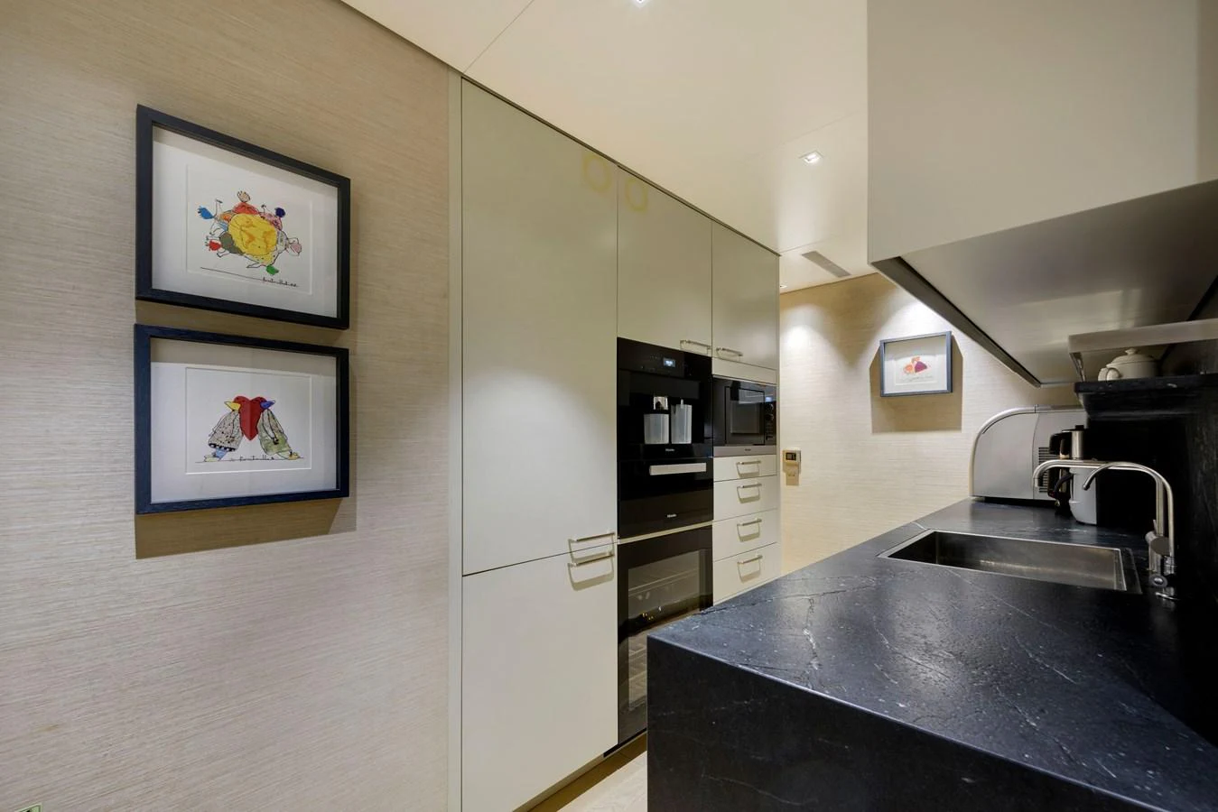 The galley features modern appliances and sleek countertops, perfect for gourmet meal preparation. aboard K Yacht for Sale