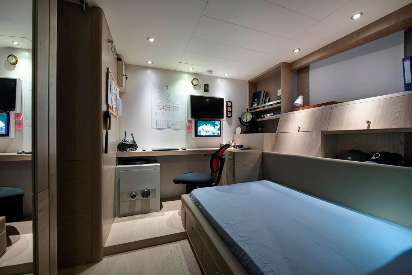 The crew quarters feature a comfortable bed, work desk, and ample storage space. aboard K Yacht for Sale
