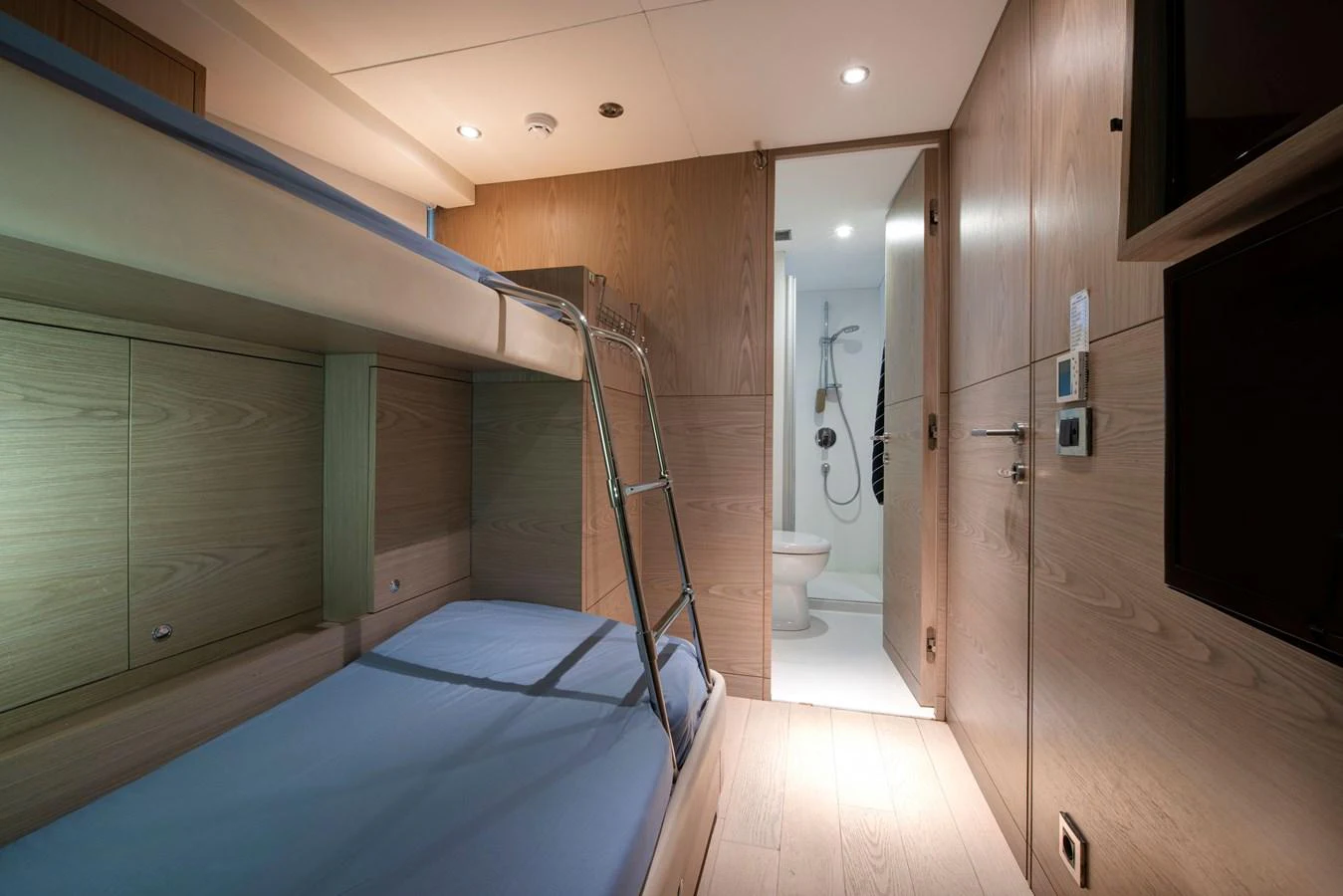 The guest cabin features cozy bunk beds and an en-suite bathroom, offering comfort and privacy. aboard K Yacht for Sale