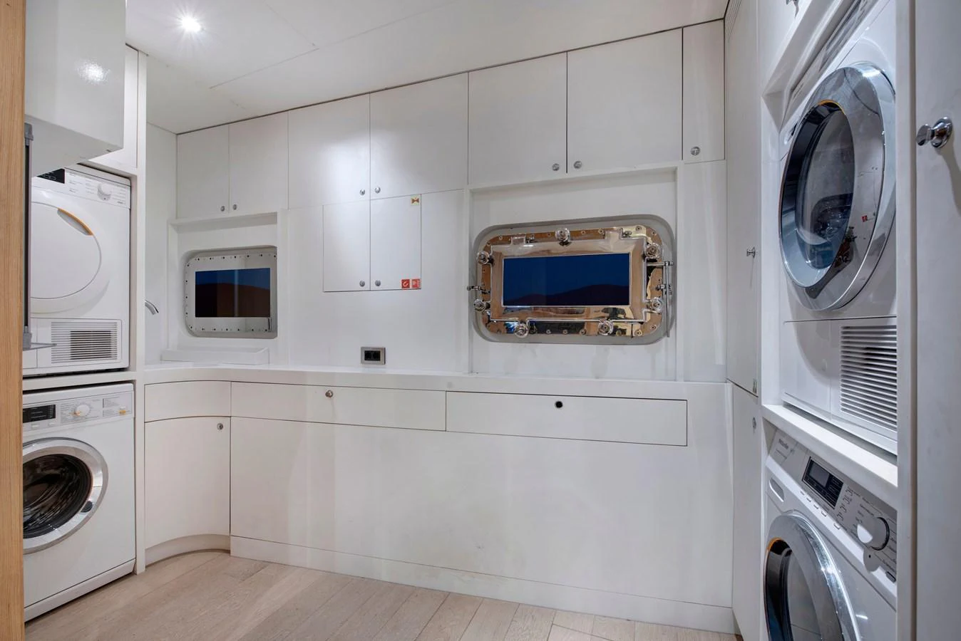 The yacht's laundry room is equipped with modern appliances and ample storage space. aboard K Yacht for Sale