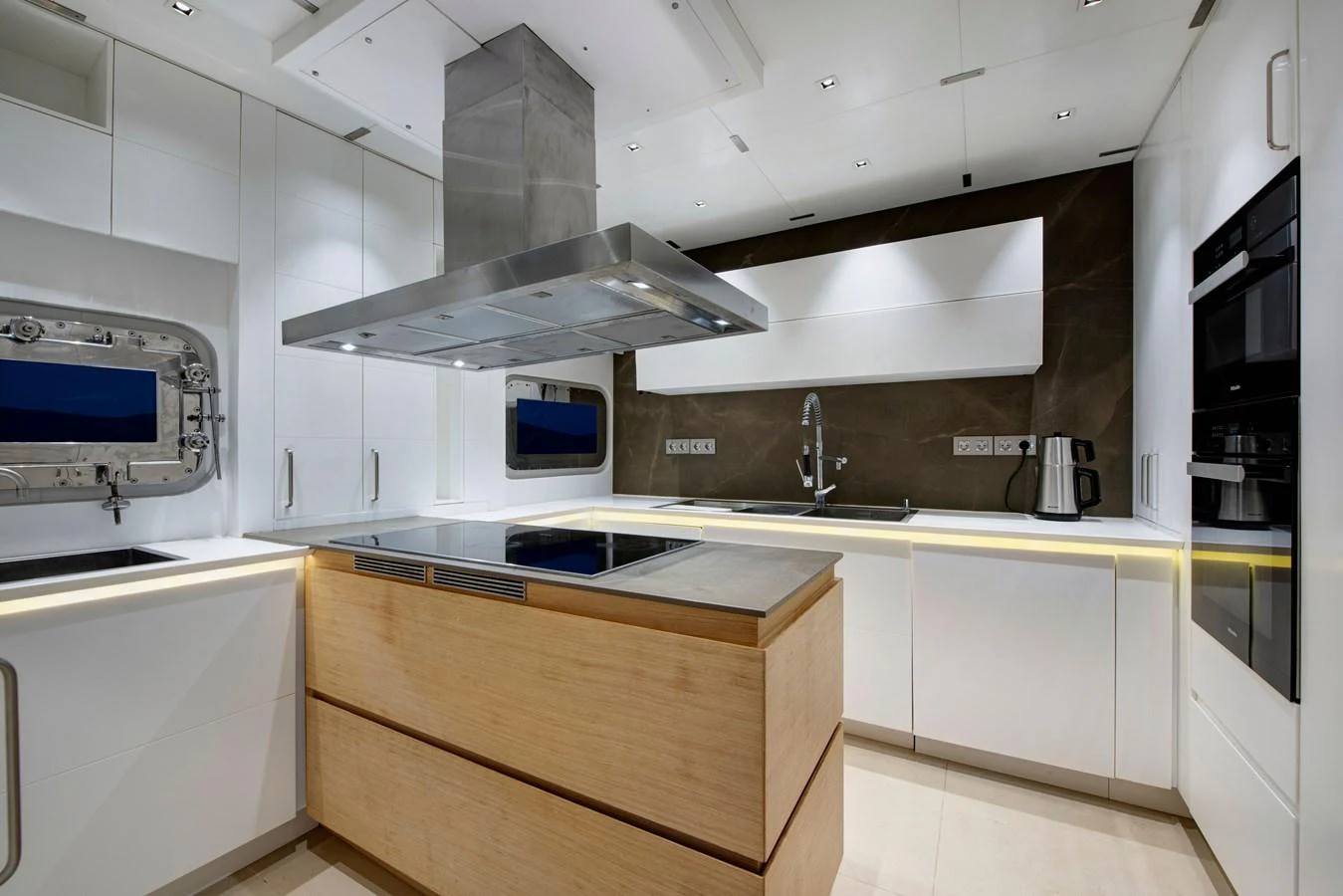 The modern galley features sleek cabinetry, high-end appliances, and ample counter space. aboard K Yacht for Sale