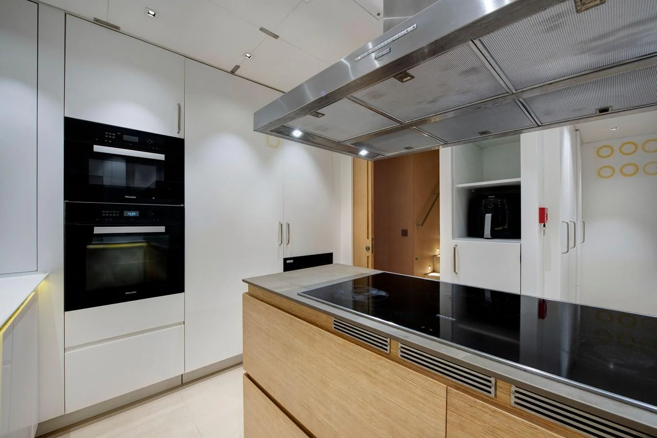 The modern galley features sleek appliances and ample counter space for gourmet meal preparation. aboard K Yacht for Sale