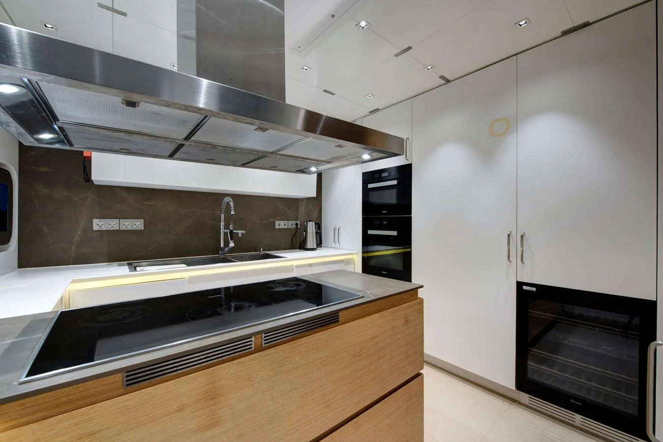 The yacht's galley features modern appliances and sleek cabinetry, perfect for gourmet meal preparation. aboard K Yacht for Sale