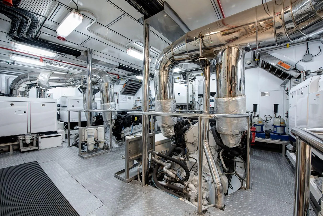 The yacht's engine room showcases advanced machinery and a pristine, well-organized layout. aboard K Yacht for Sale