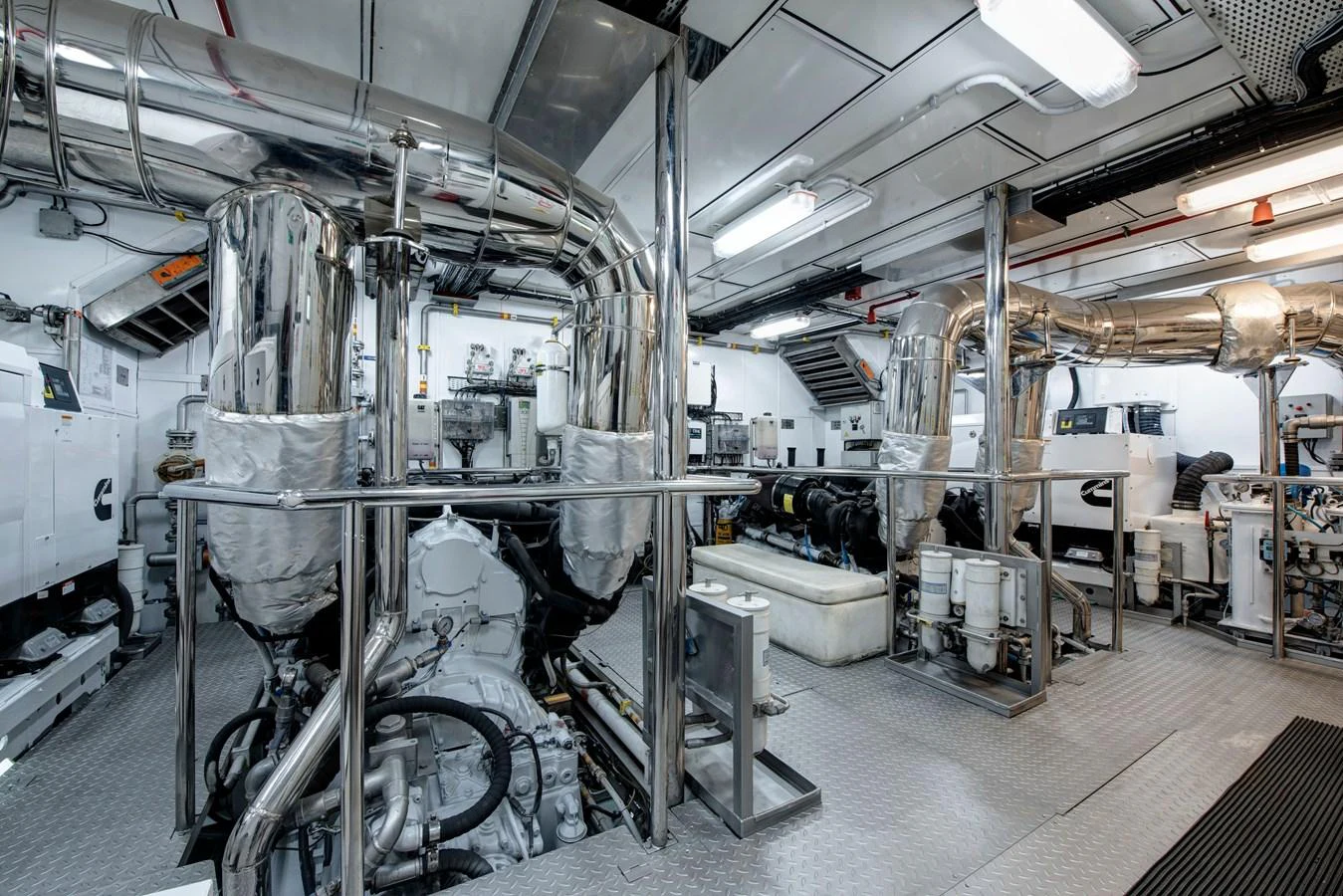 The yacht's engine room showcases advanced machinery and a pristine, well-organized layout. aboard K Yacht for Sale