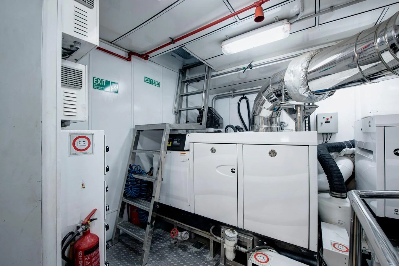 The engine room is equipped with essential machinery and safety equipment. aboard K Yacht for Sale