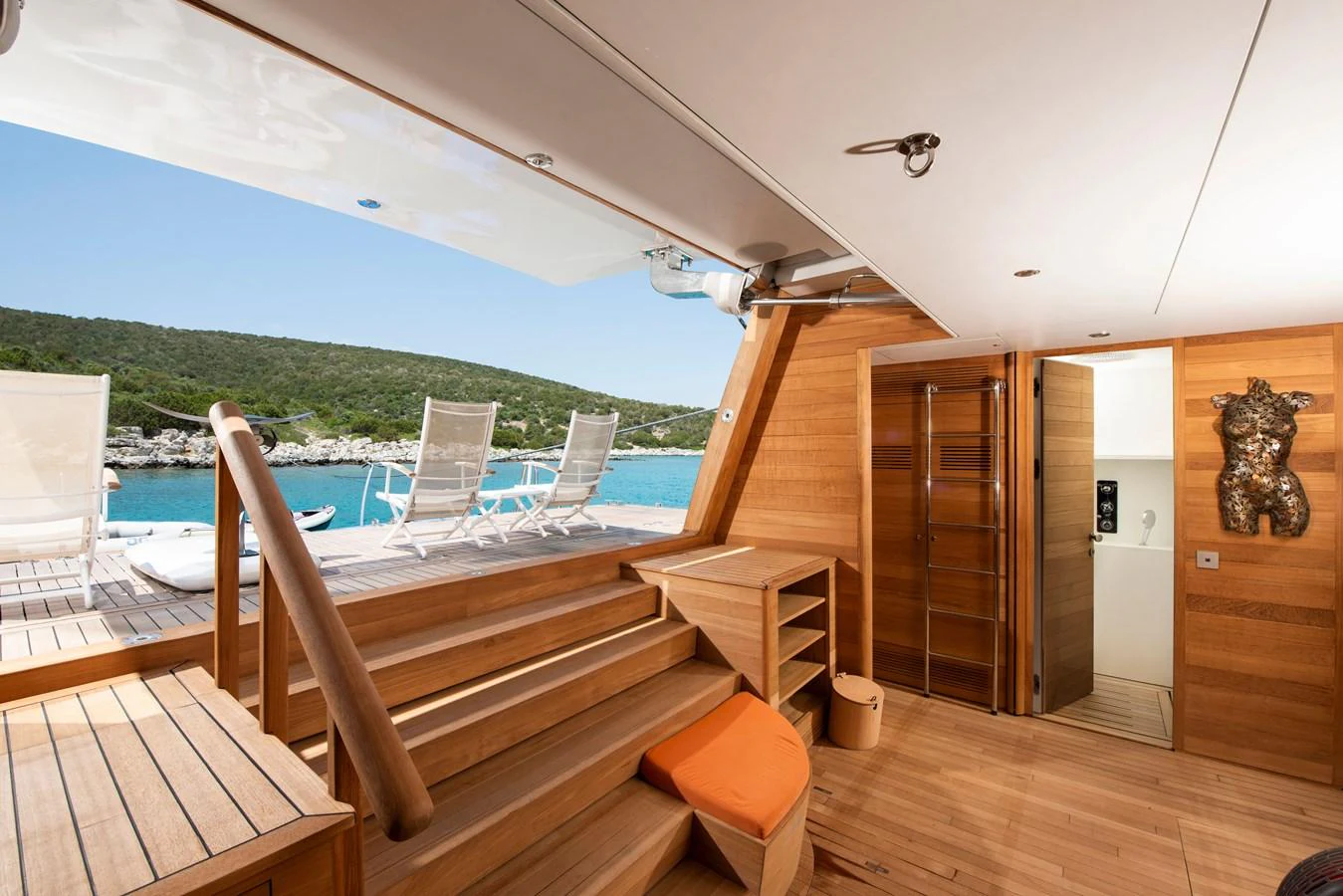 The aft deck features a seamless transition from the interior to an inviting outdoor lounging area with stunning views. aboard K Yacht for Sale