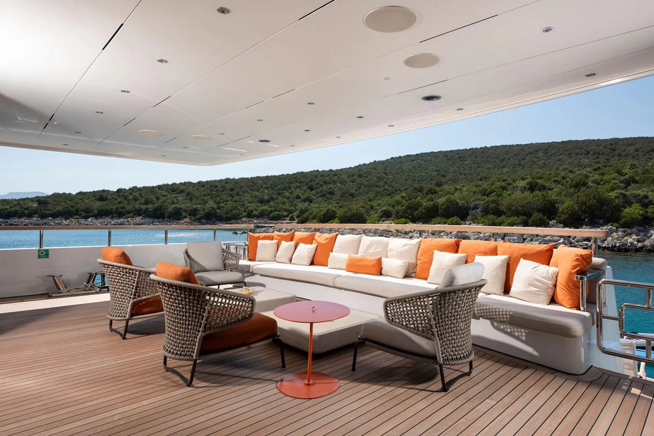 The aft deck features a spacious seating area with comfortable cushions and scenic views. aboard K Yacht for Sale