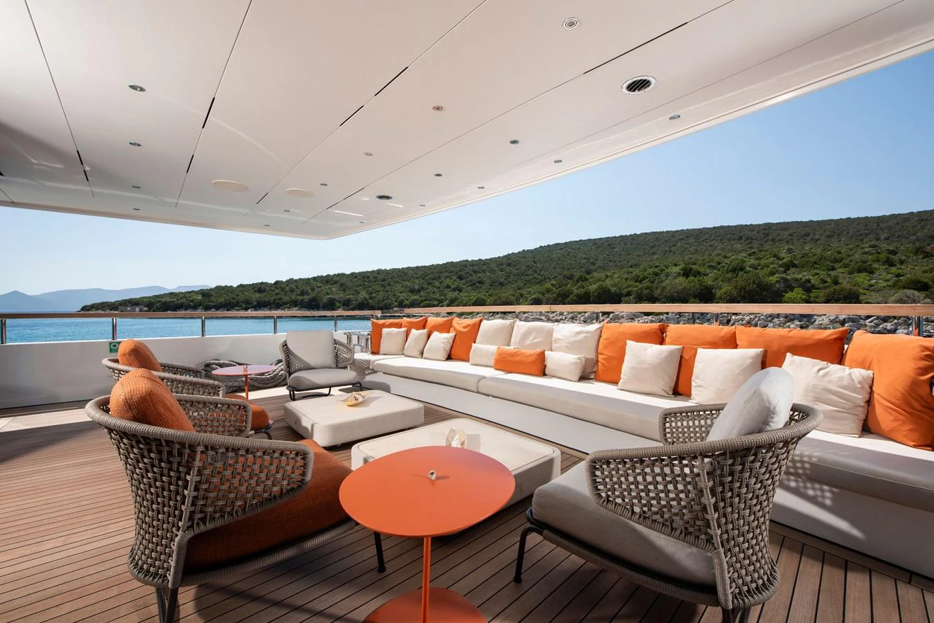 The aft deck features a spacious and stylish seating area with a stunning view of the surrounding landscape. aboard K Yacht for Sale