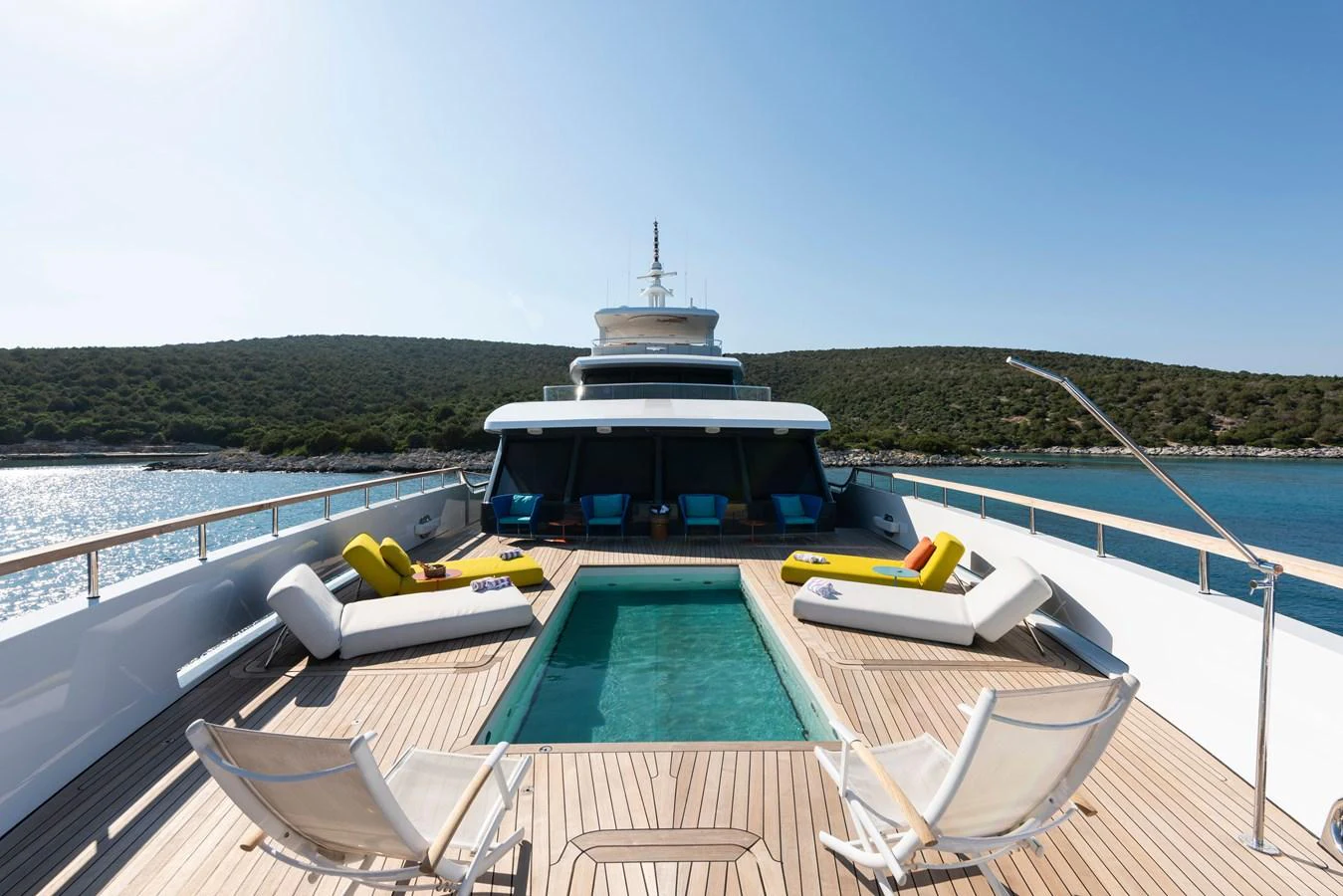 The sundeck features a luxurious pool surrounded by comfortable lounging areas, perfect for relaxation. aboard K Yacht for Sale