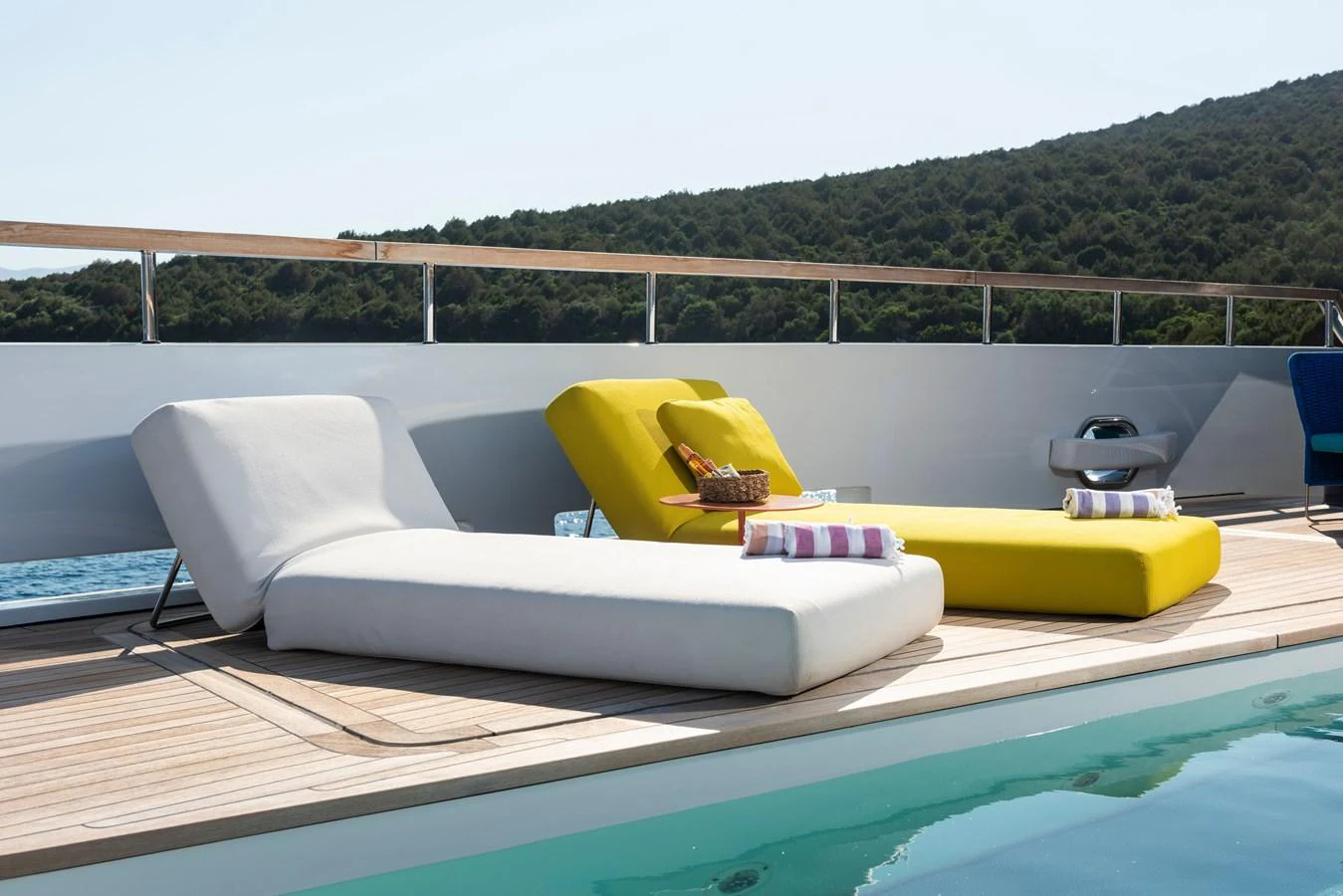 The sundeck features luxurious loungers and a serene pool area, perfect for relaxation. aboard K Yacht for Sale