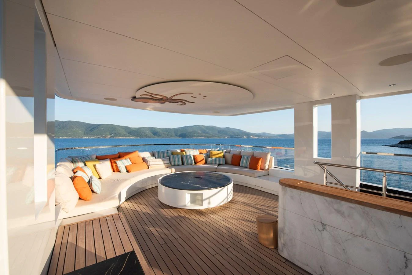 The aft deck features a spacious seating area with panoramic ocean views. aboard K Yacht for Sale