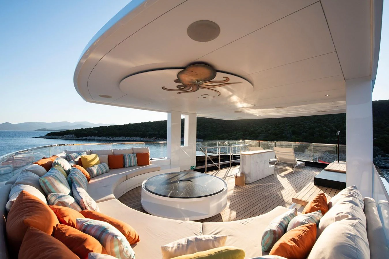 The sundeck features luxurious seating and a central hot tub, perfect for relaxation and enjoying the views. aboard K Yacht for Sale