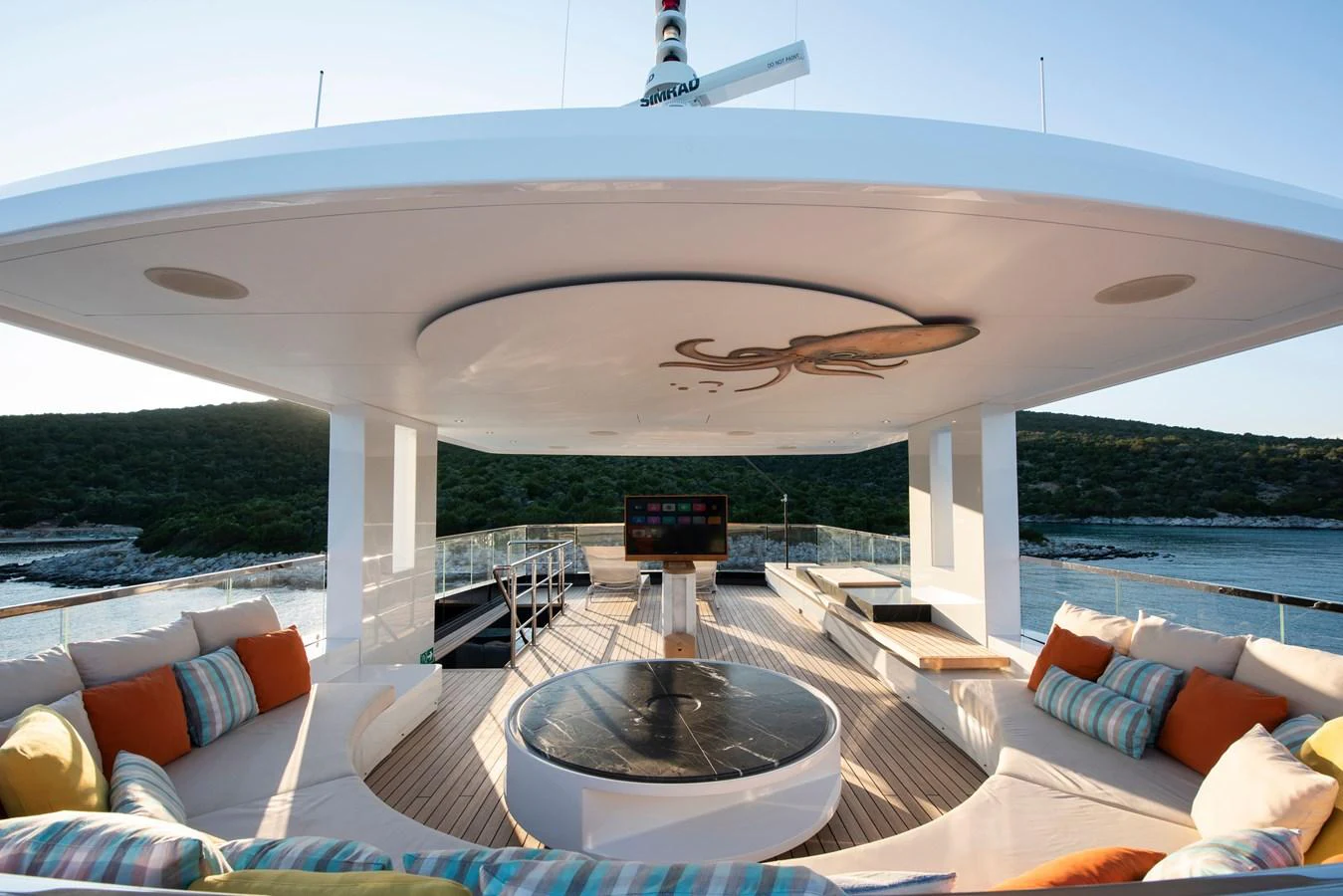 The sundeck features a comfortable seating area with panoramic views. aboard K Yacht for Sale