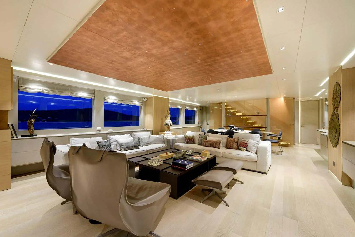 The salon features luxurious seating with a modern design and ample natural light. aboard K Yacht for Sale