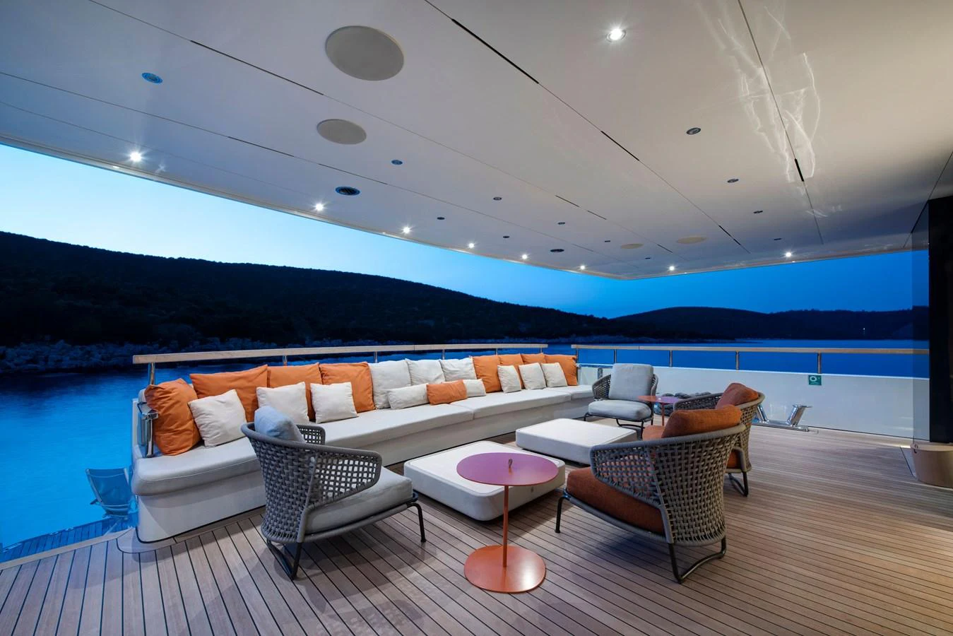 The aft deck features a spacious seating area with plush cushions and modern furniture, perfect for relaxation and socializing. aboard K Yacht for Sale