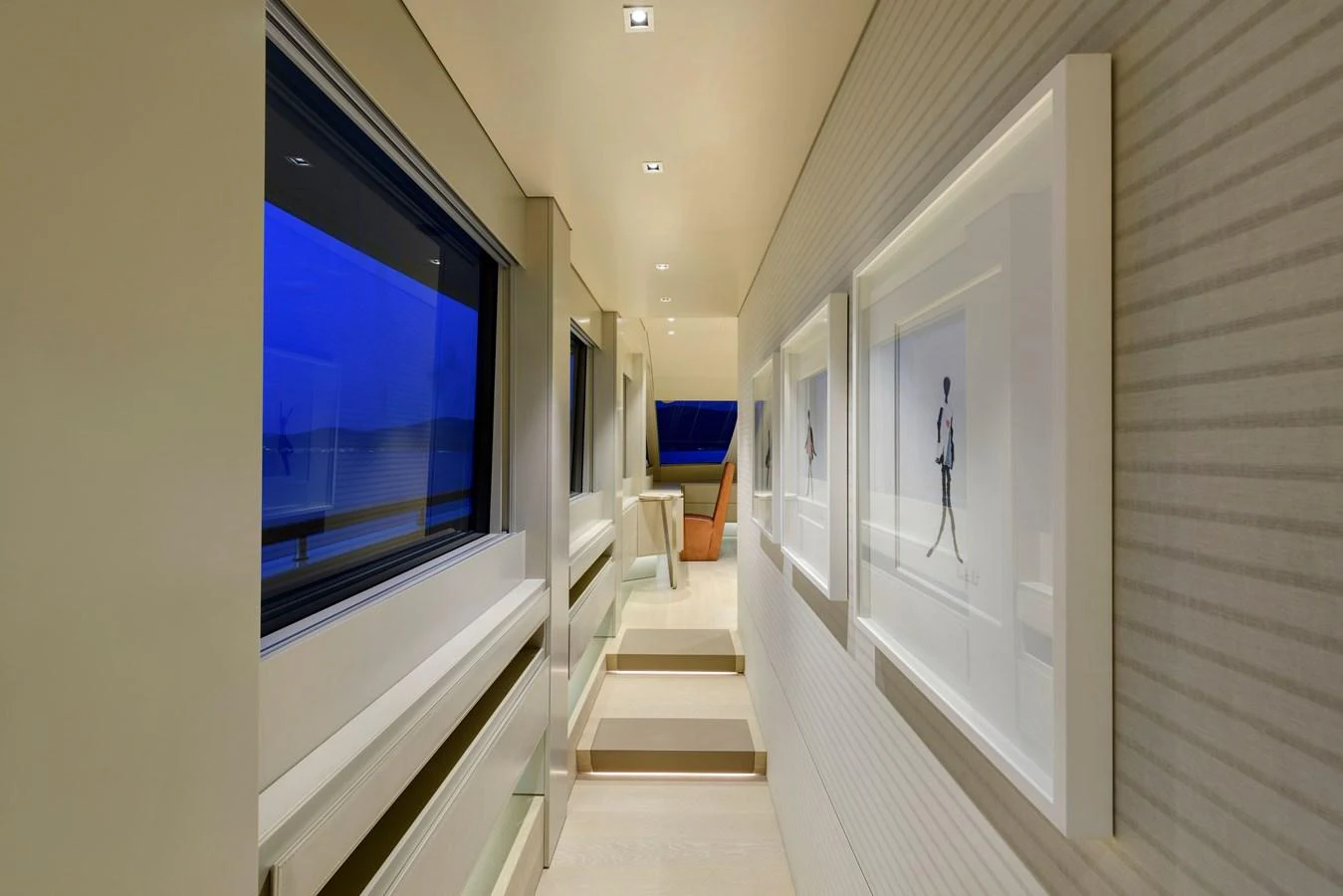 A sleek and modern hallway with elegant artwork and ambient lighting. aboard K Yacht for Sale
