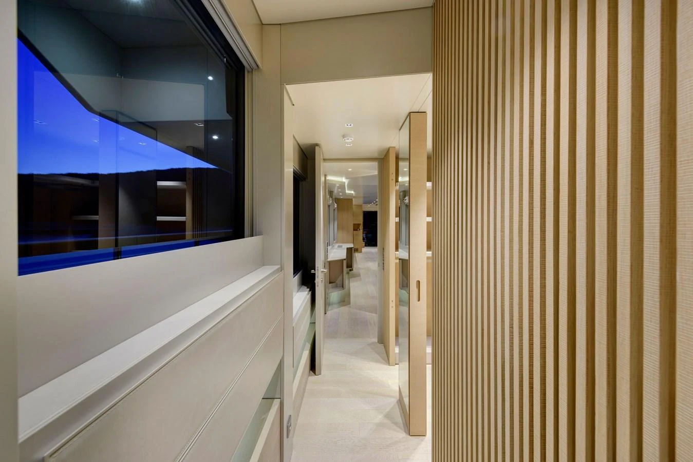 A sleek, modern hallway with elegant lighting and wooden accents. aboard K Yacht for Sale