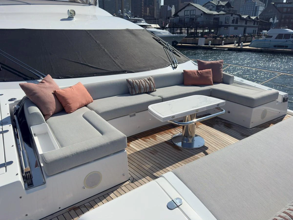 The aft deck features a spacious seating area with comfortable cushions and a sleek table, perfect for relaxation and socializing. aboard 2022 AZIMUT GRANDE 25M Yacht for Sale