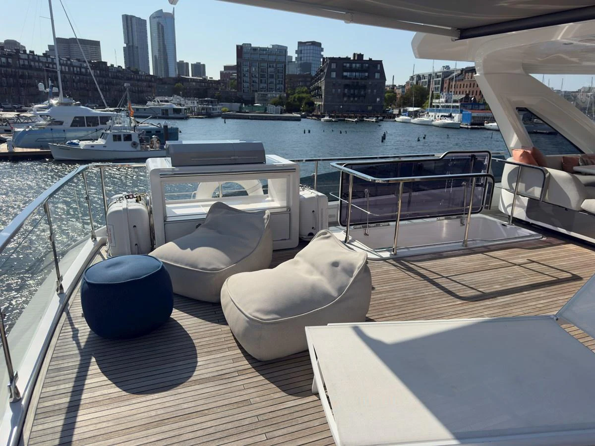 The flybridge offers a relaxing outdoor space with comfortable seating and stunning views of the marina. aboard 2022 AZIMUT GRANDE 25M Yacht for Sale