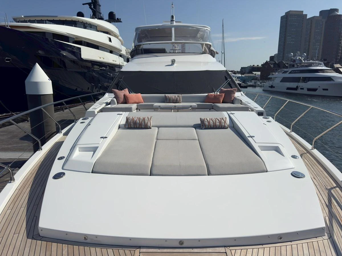 The foredeck features a spacious sunbathing area with plush cushions and elegant design. aboard 2022 AZIMUT GRANDE 25M Yacht for Sale