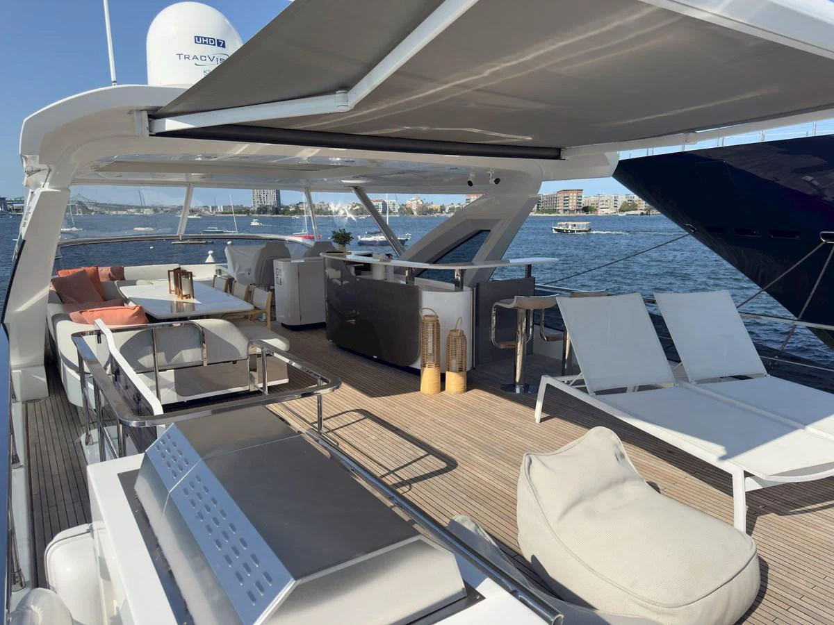 The flybridge offers a spacious and luxurious outdoor living area with ample seating and lounging options. aboard 2022 AZIMUT GRANDE 25M Yacht for Sale