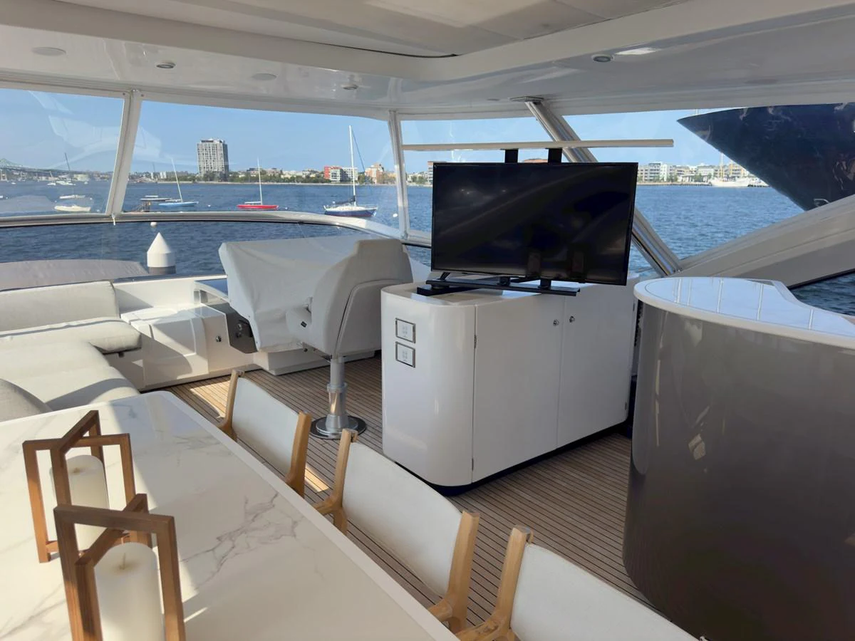 The salon offers a comfortable and stylish space with a view of the water. aboard 2022 AZIMUT GRANDE 25M Yacht for Sale