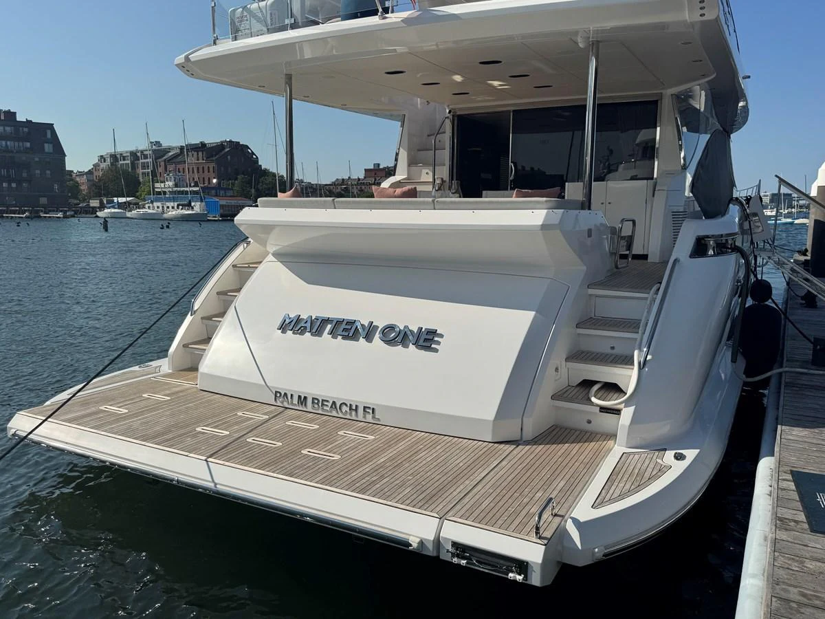 The yacht's aft deck features a spacious swim platform and elegant design, perfect for waterfront relaxation. aboard 2022 AZIMUT GRANDE 25M Yacht for Sale