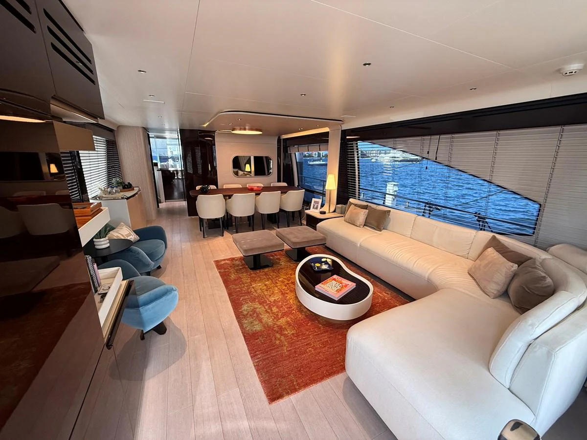 The salon offers a spacious and elegant living area with modern furnishings and large windows providing stunning sea views. aboard 2022 AZIMUT GRANDE 25M Yacht for Sale