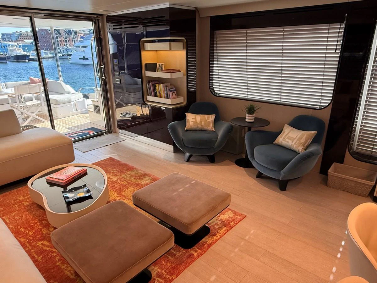 The salon offers a cozy and stylish space with comfortable seating and a view of the marina. aboard 2022 AZIMUT GRANDE 25M Yacht for Sale
