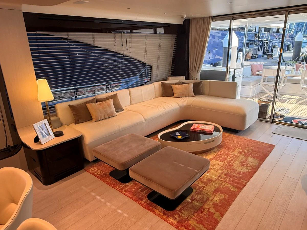 The salon features a spacious and elegant seating area with modern furnishings and a warm ambiance. aboard 2022 AZIMUT GRANDE 25M Yacht for Sale