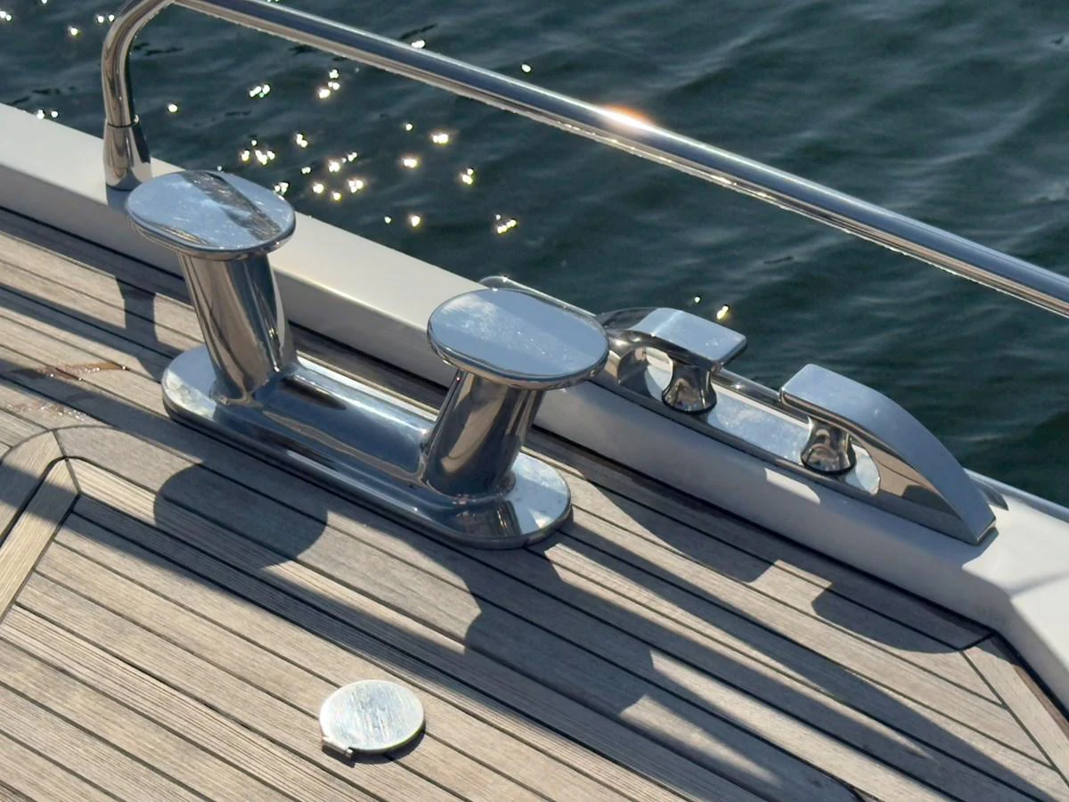 A close-up view of polished stainless steel cleats on the yacht's deck. aboard 2022 AZIMUT GRANDE 25M Yacht for Sale